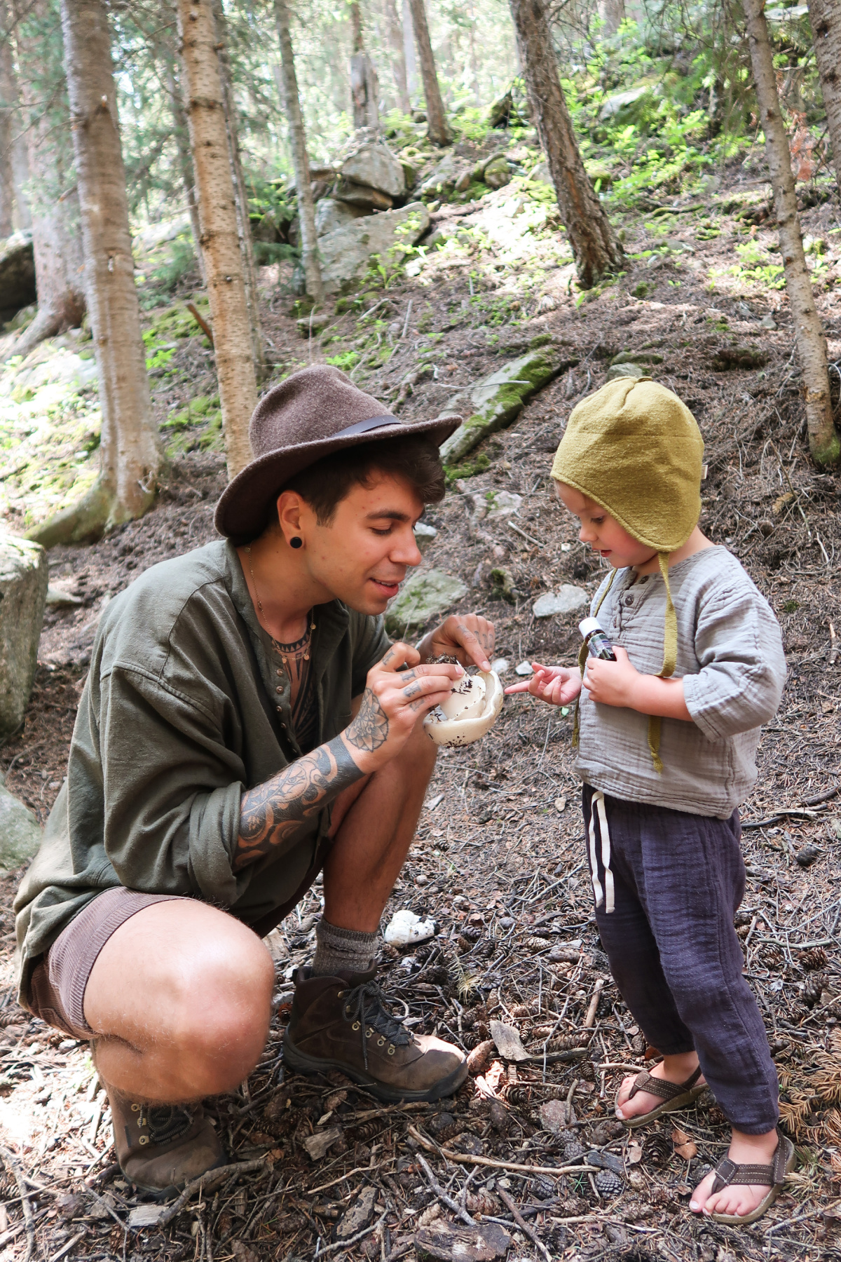 man showing girl a mushroom