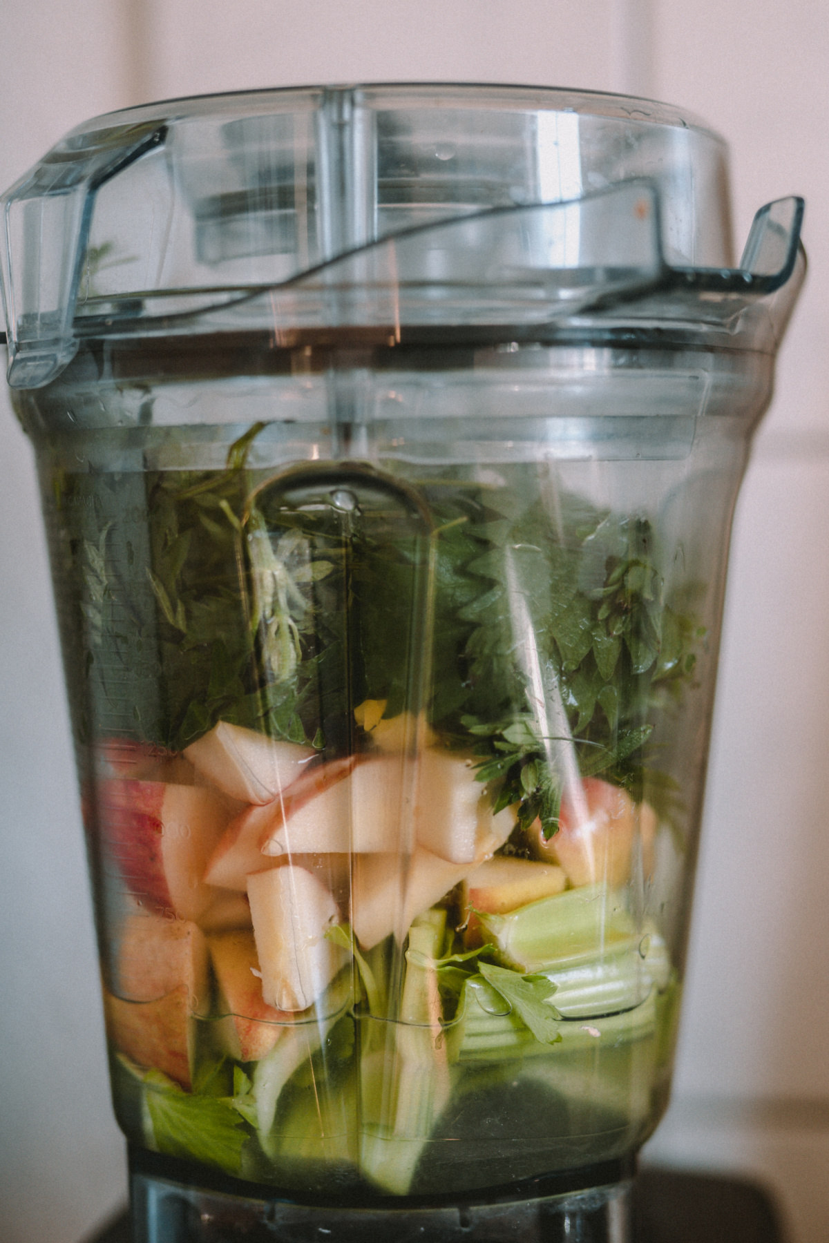 ingredients in a blender to make a green juice