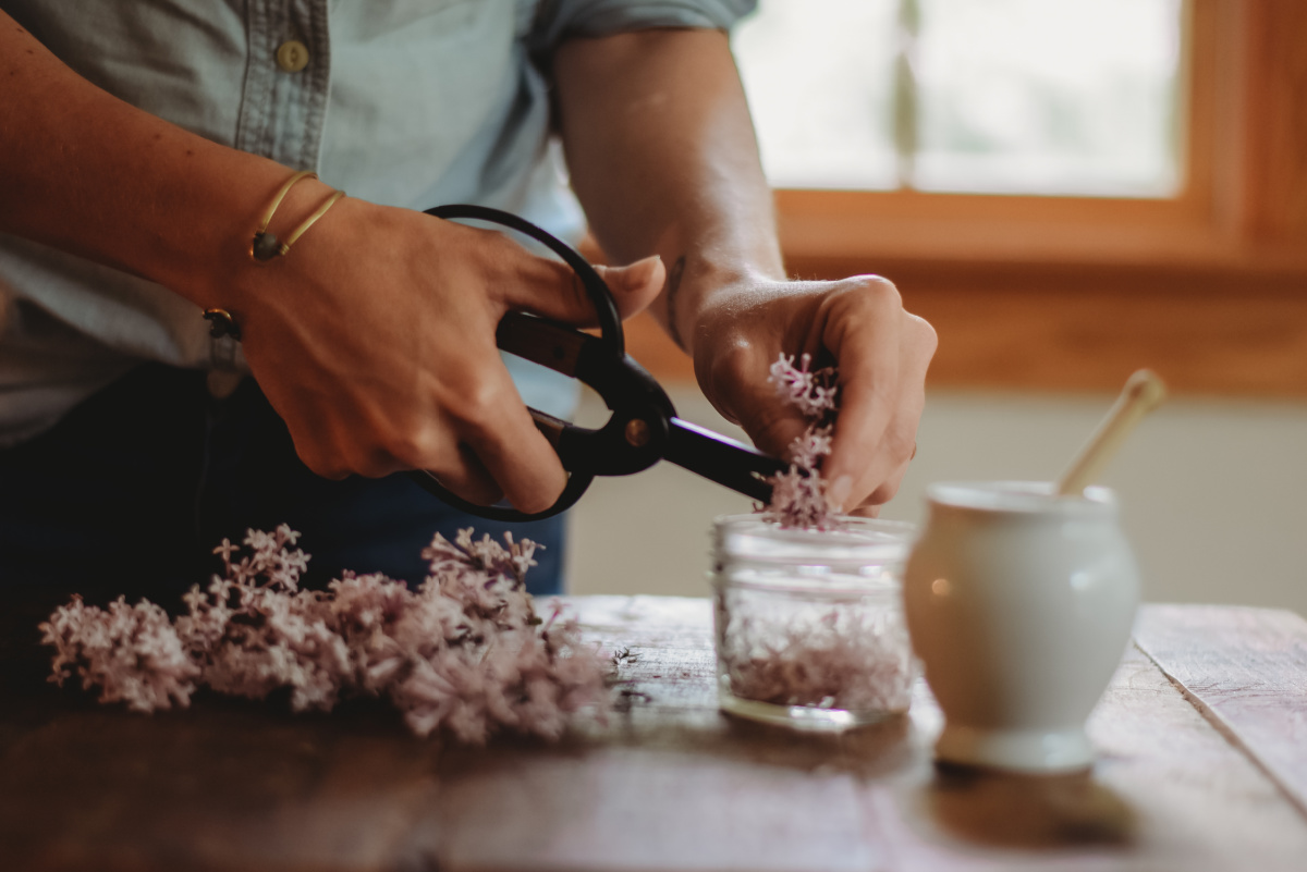 woman making an herbal honey