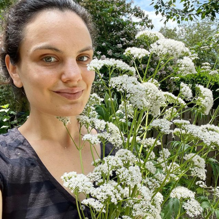 Anna Booth Cohen holding queen Anne's lace