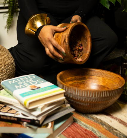 woman pouring herb into a bowl