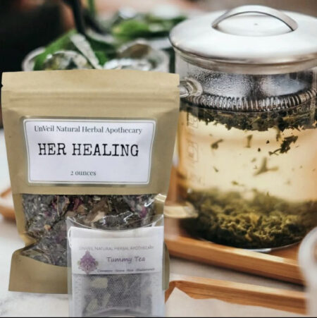 bags of herbs with tea steeping in the background