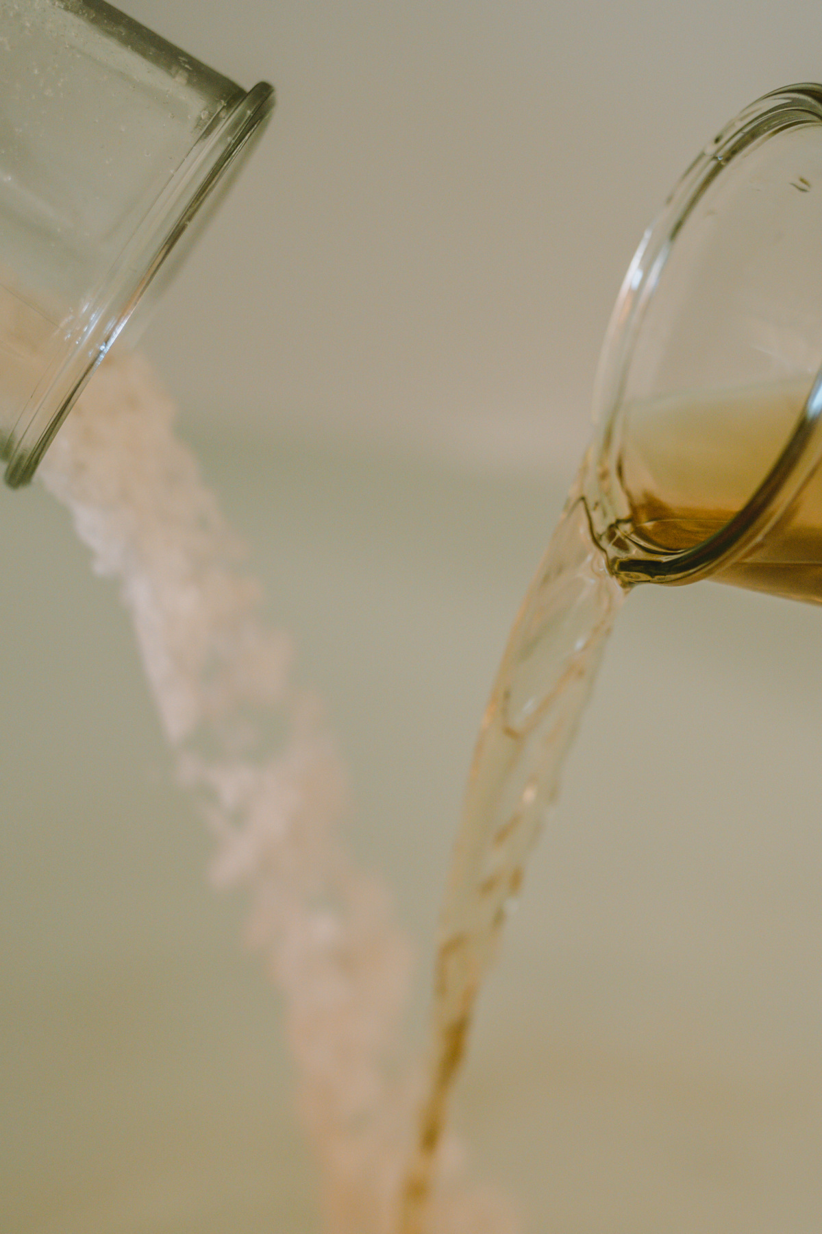 pouring oats and tea into a baby bath