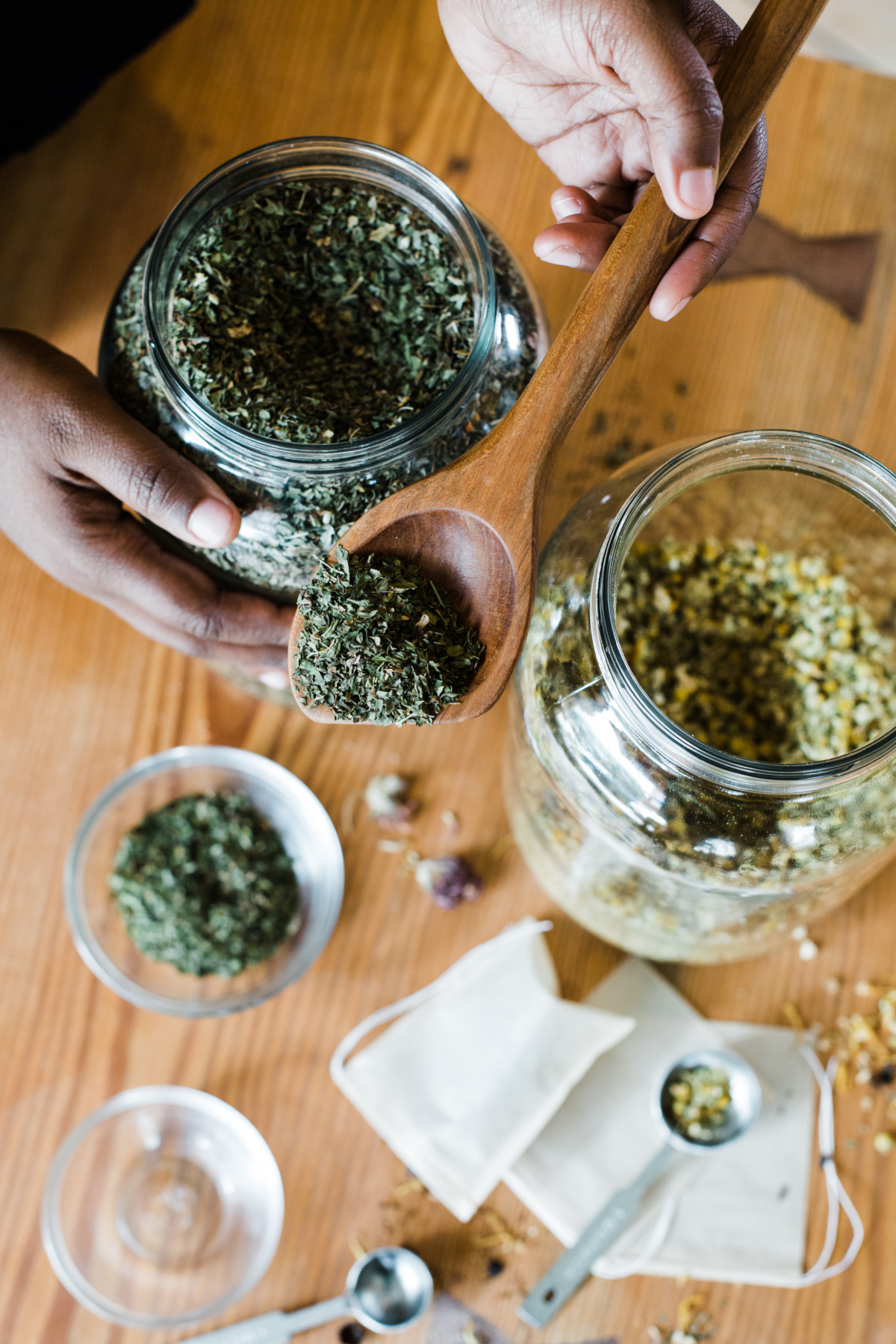 assorted containers of dried herbs 