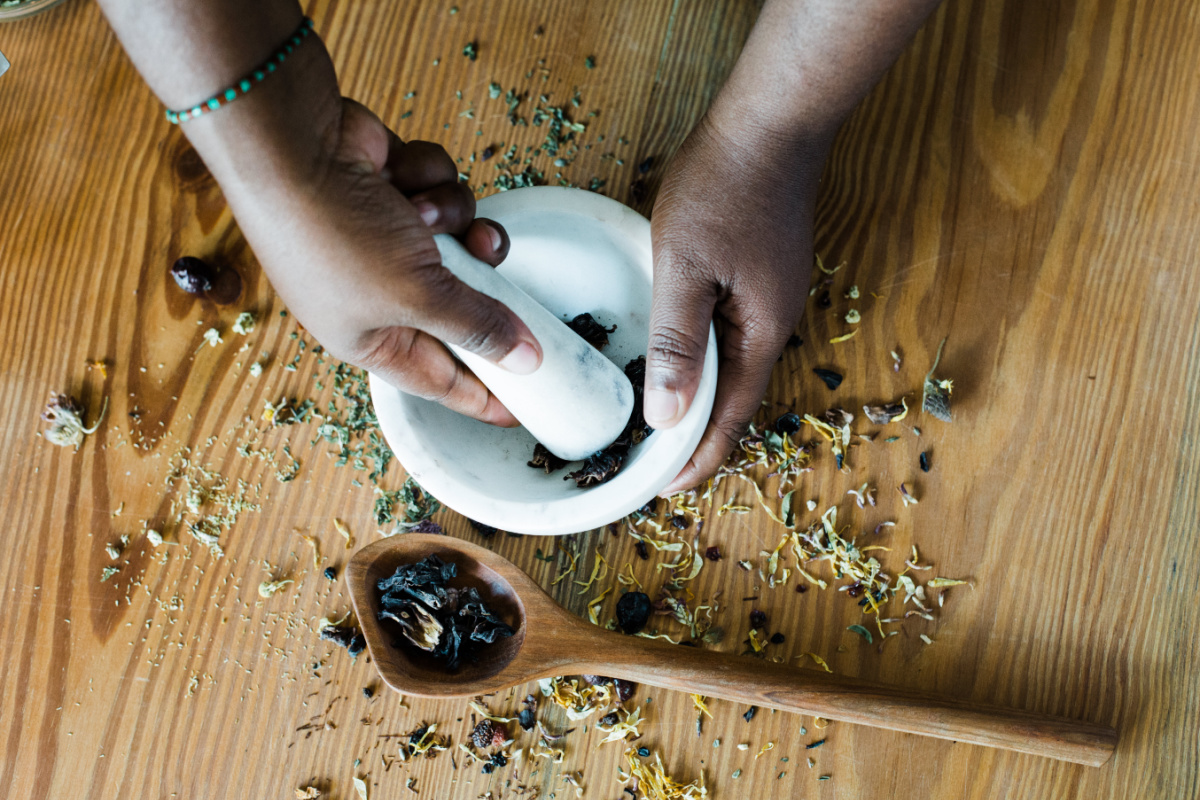 hands crushing herbs