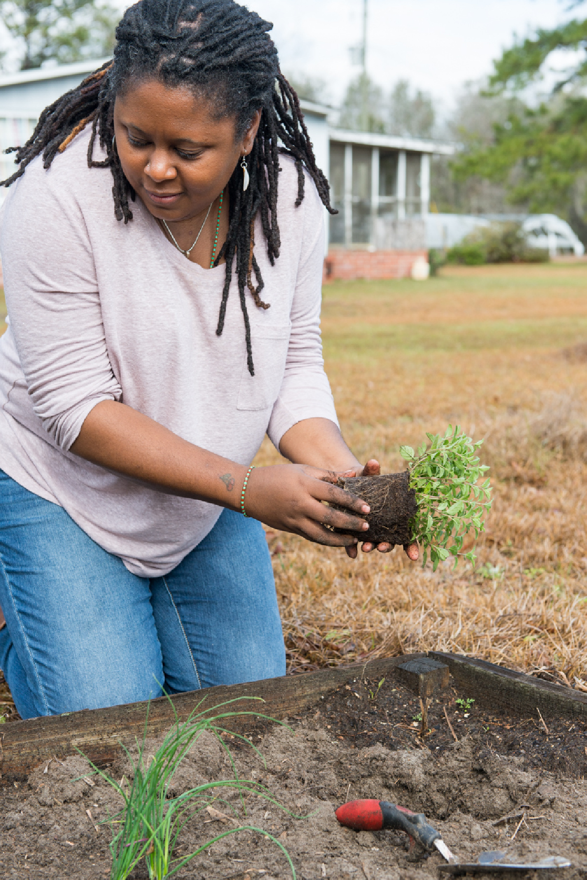 woman planting herbs