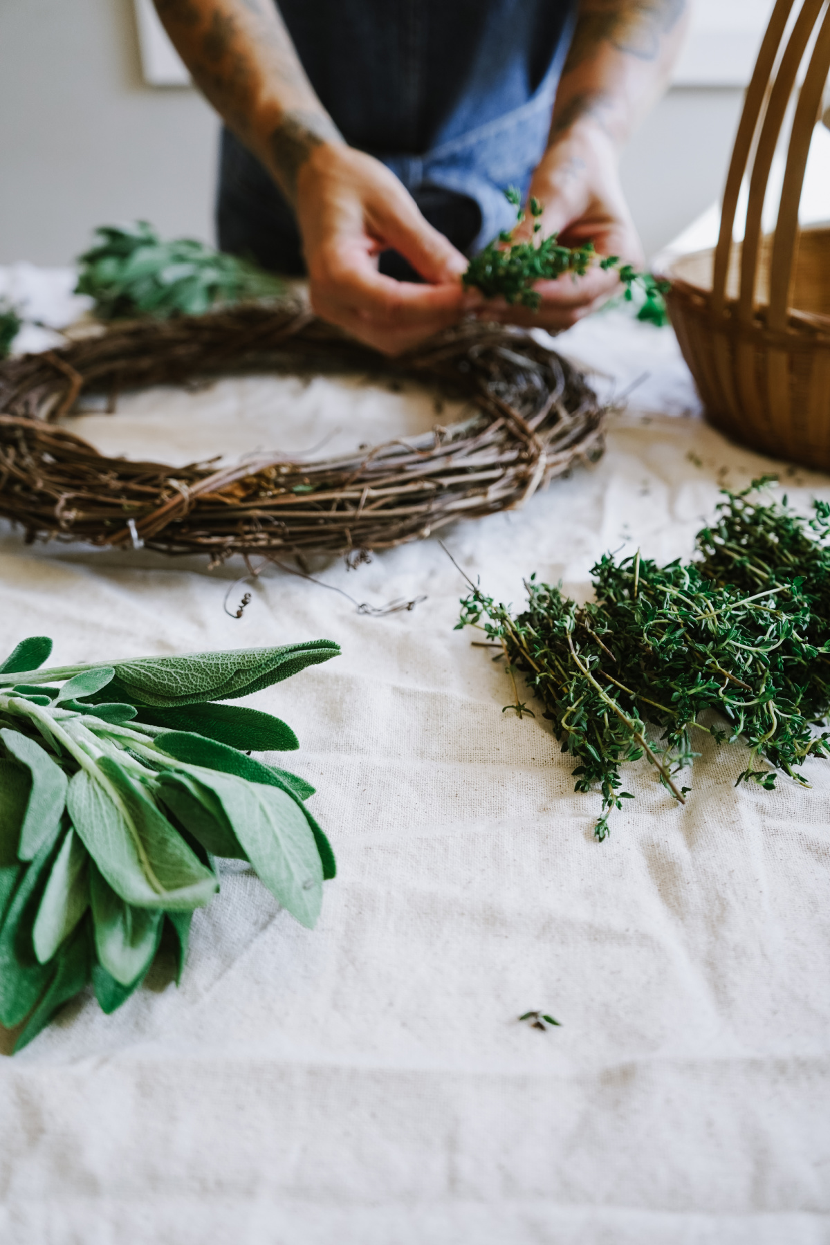 placing herbs on fall wreath