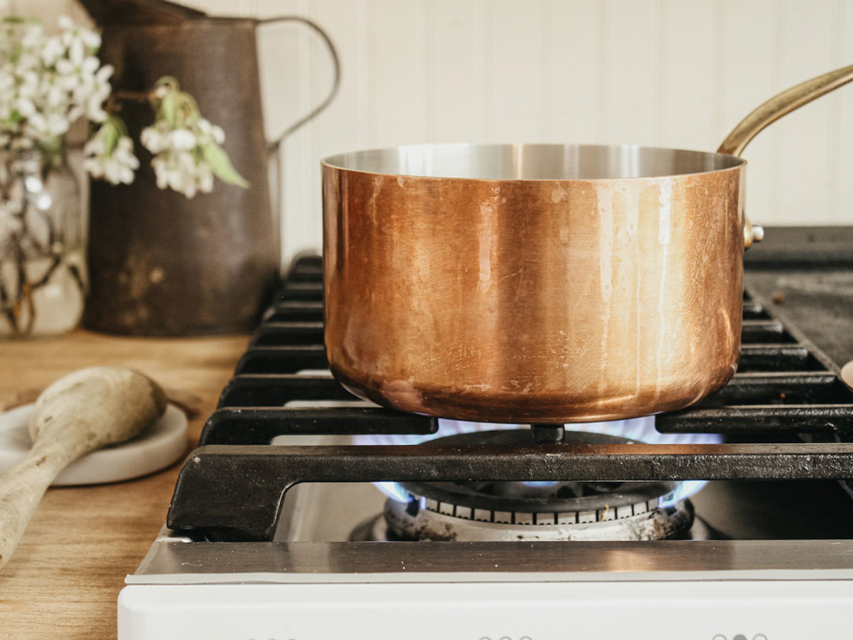 copper pan on gas stove burner