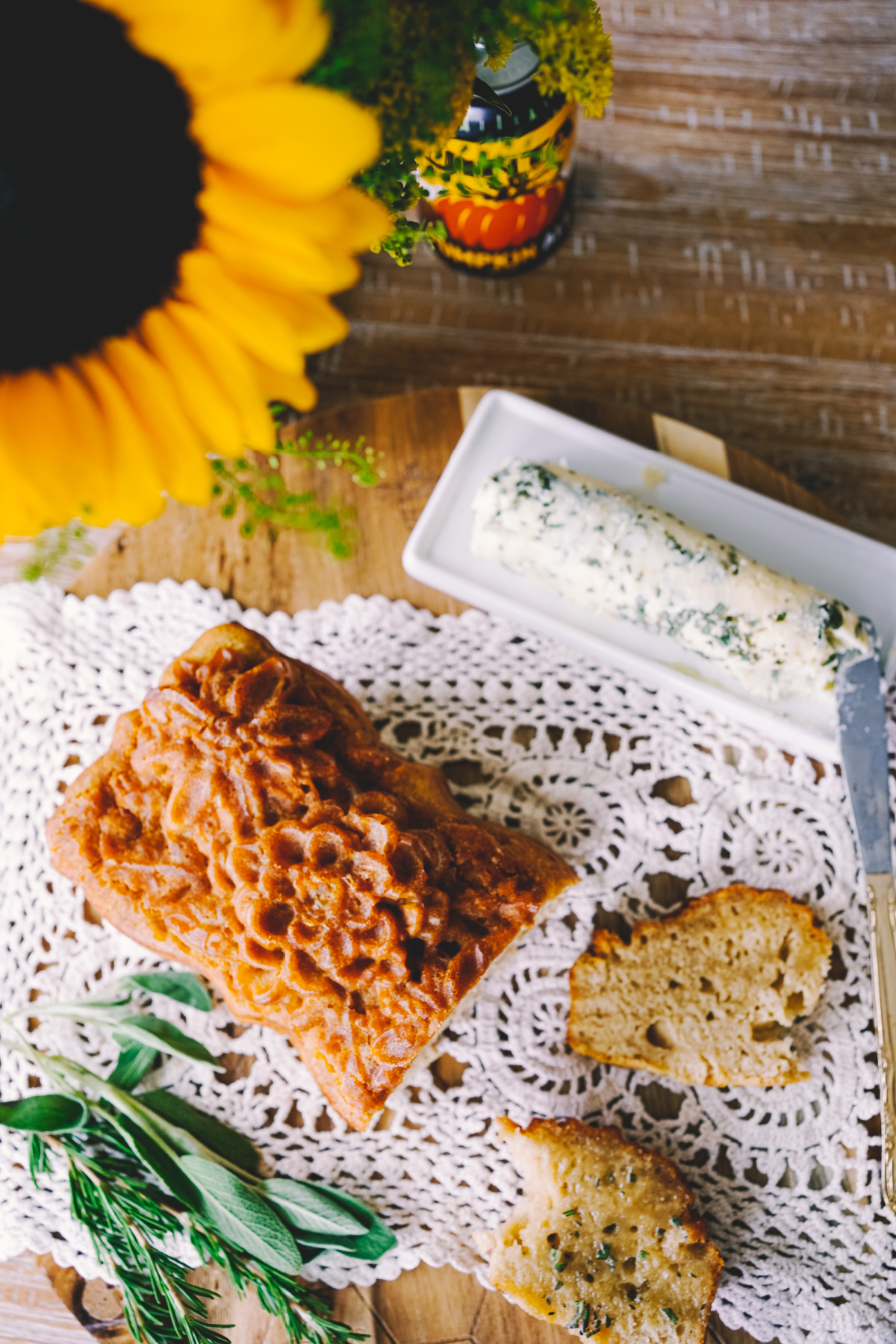 sliced pumpkin beer bread with herb butter