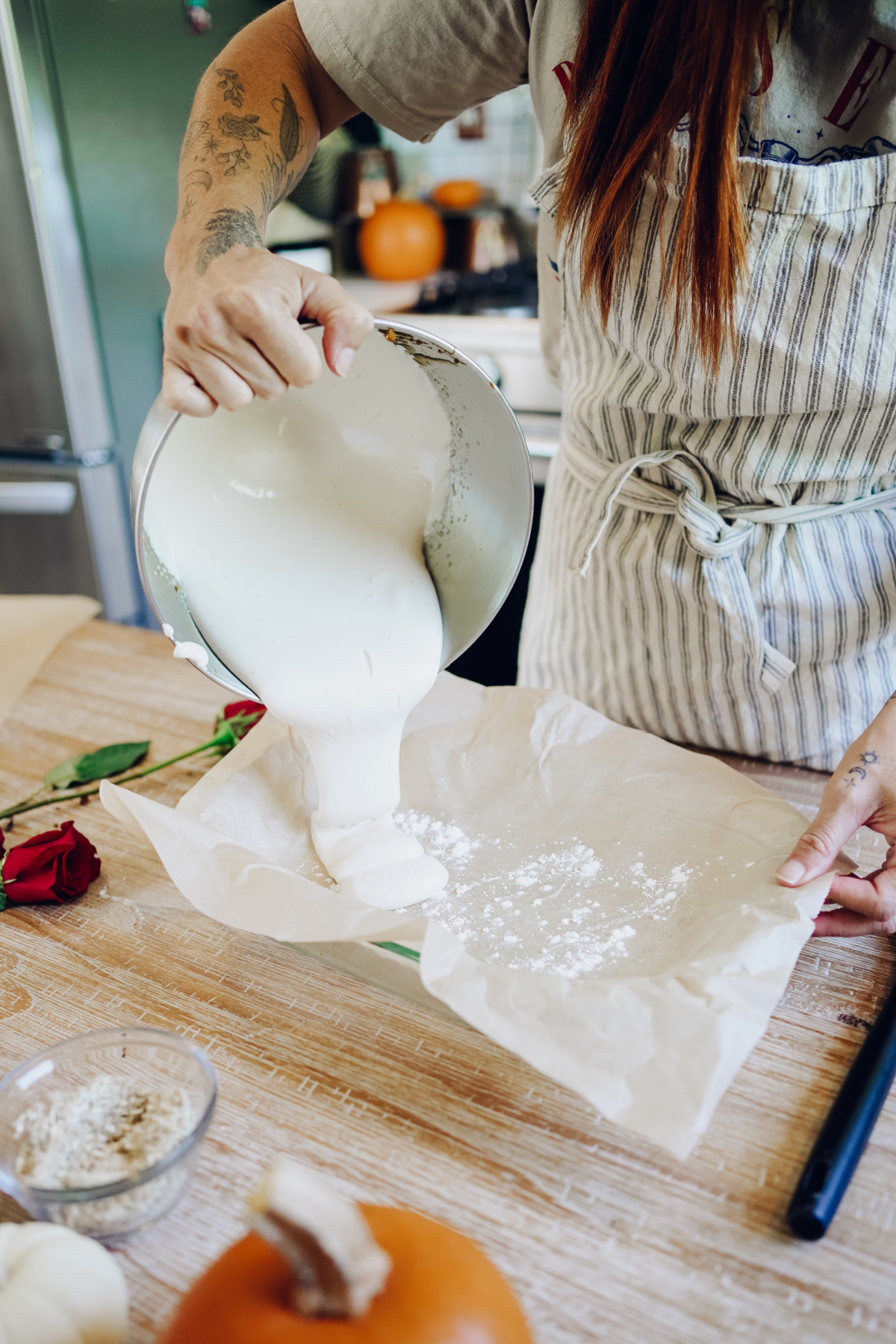 pouring marshmallow mix into a pan