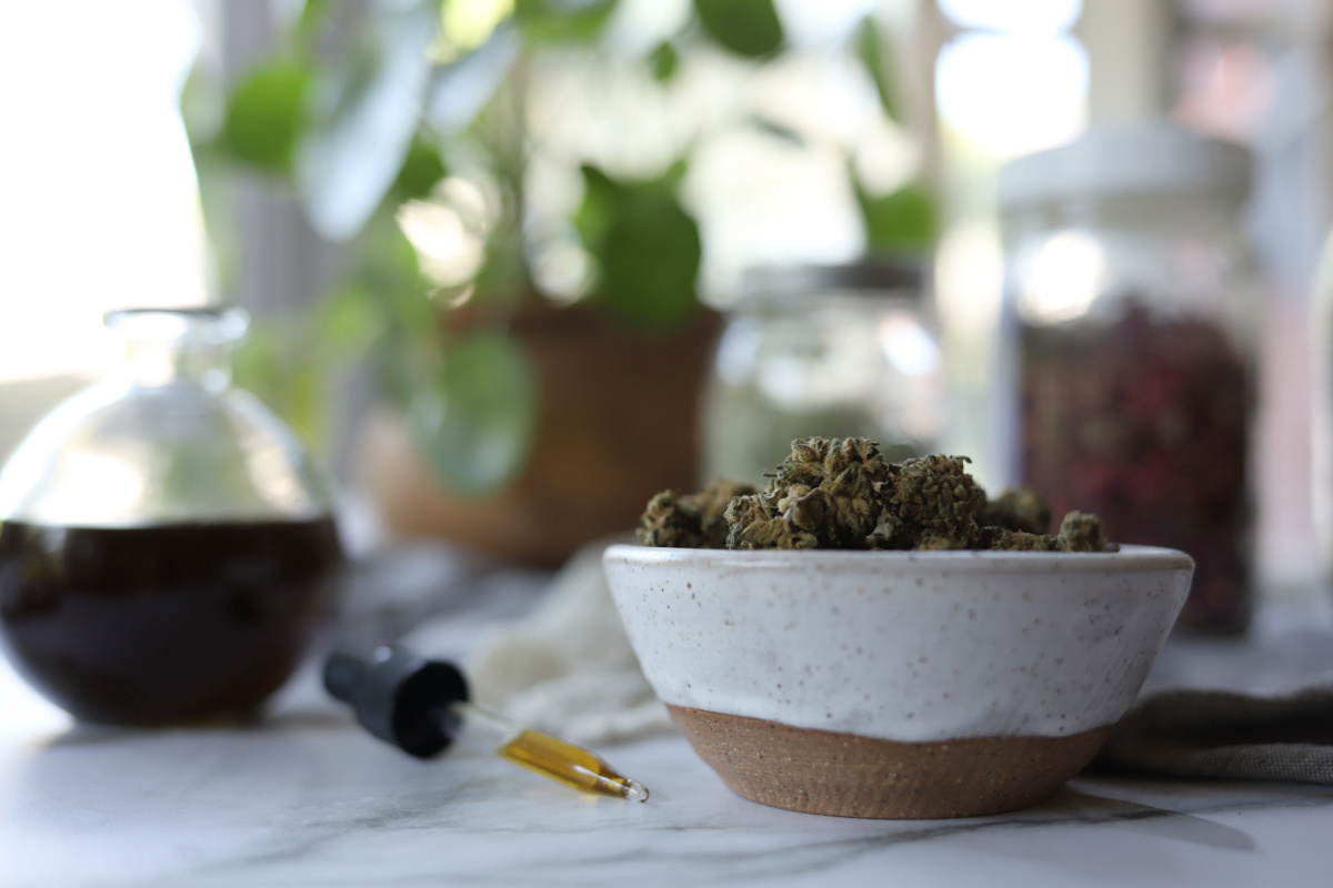 cannabis in a bowl with adaptogens in background