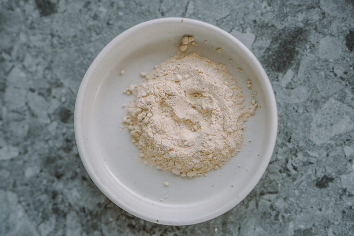 maca powder in a while glass bowl