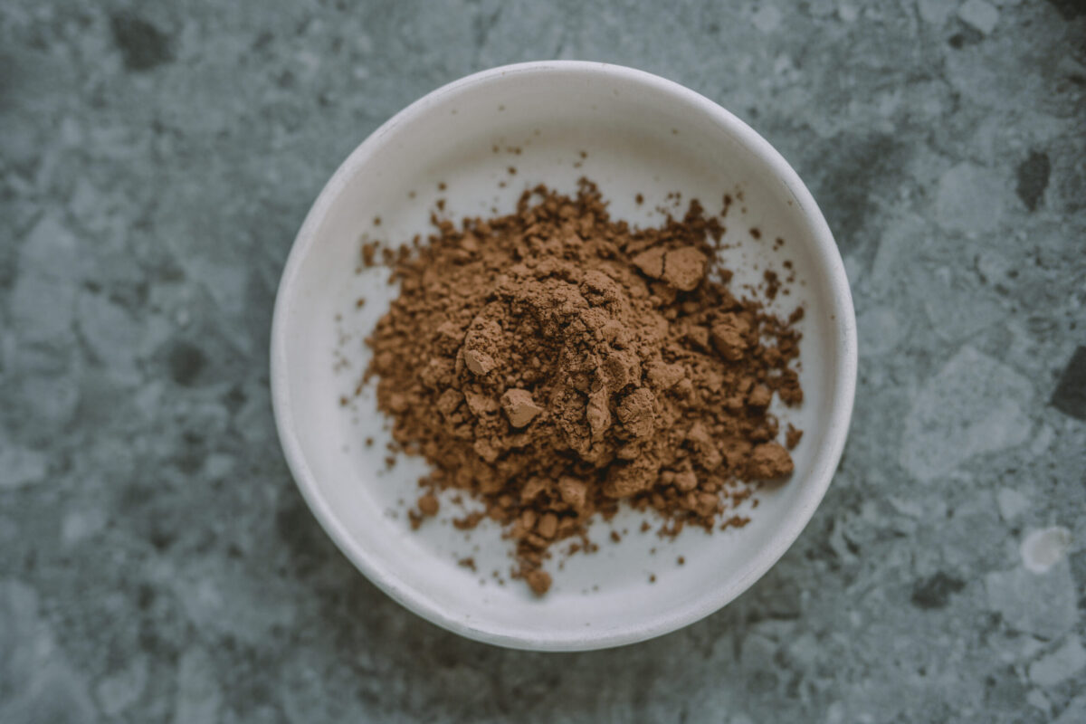 raw cacao powder in a glass bowl