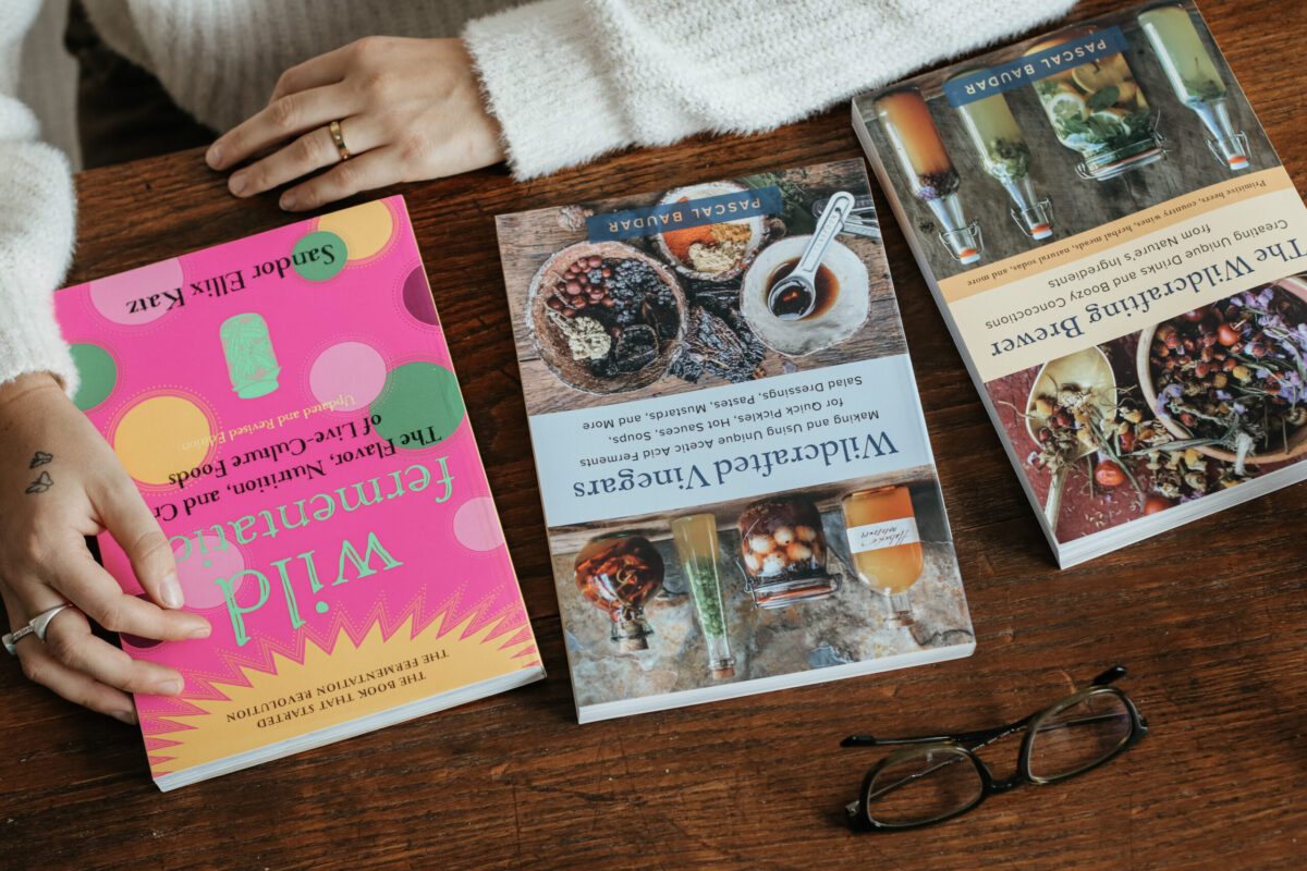 three books lined on a table