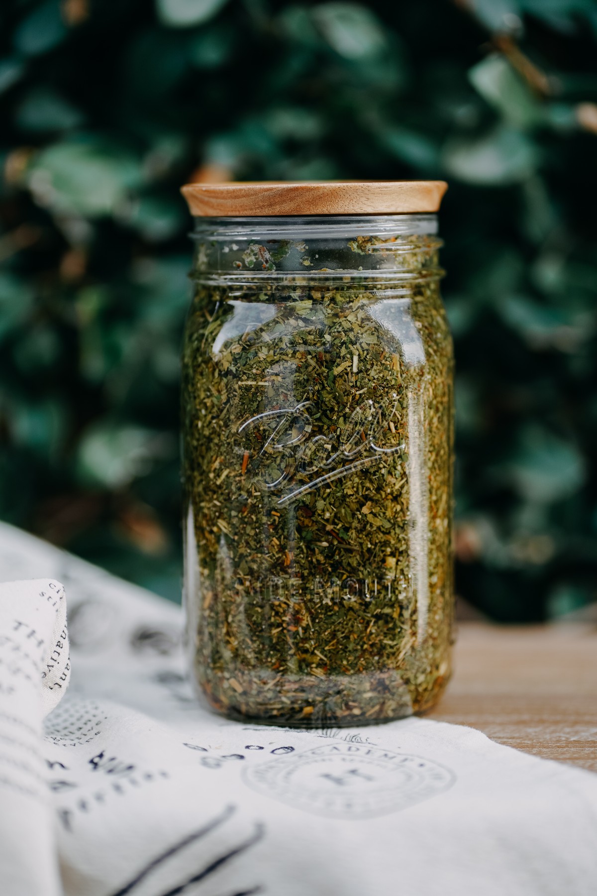jar of dried herbs steeping for herbal fever ease