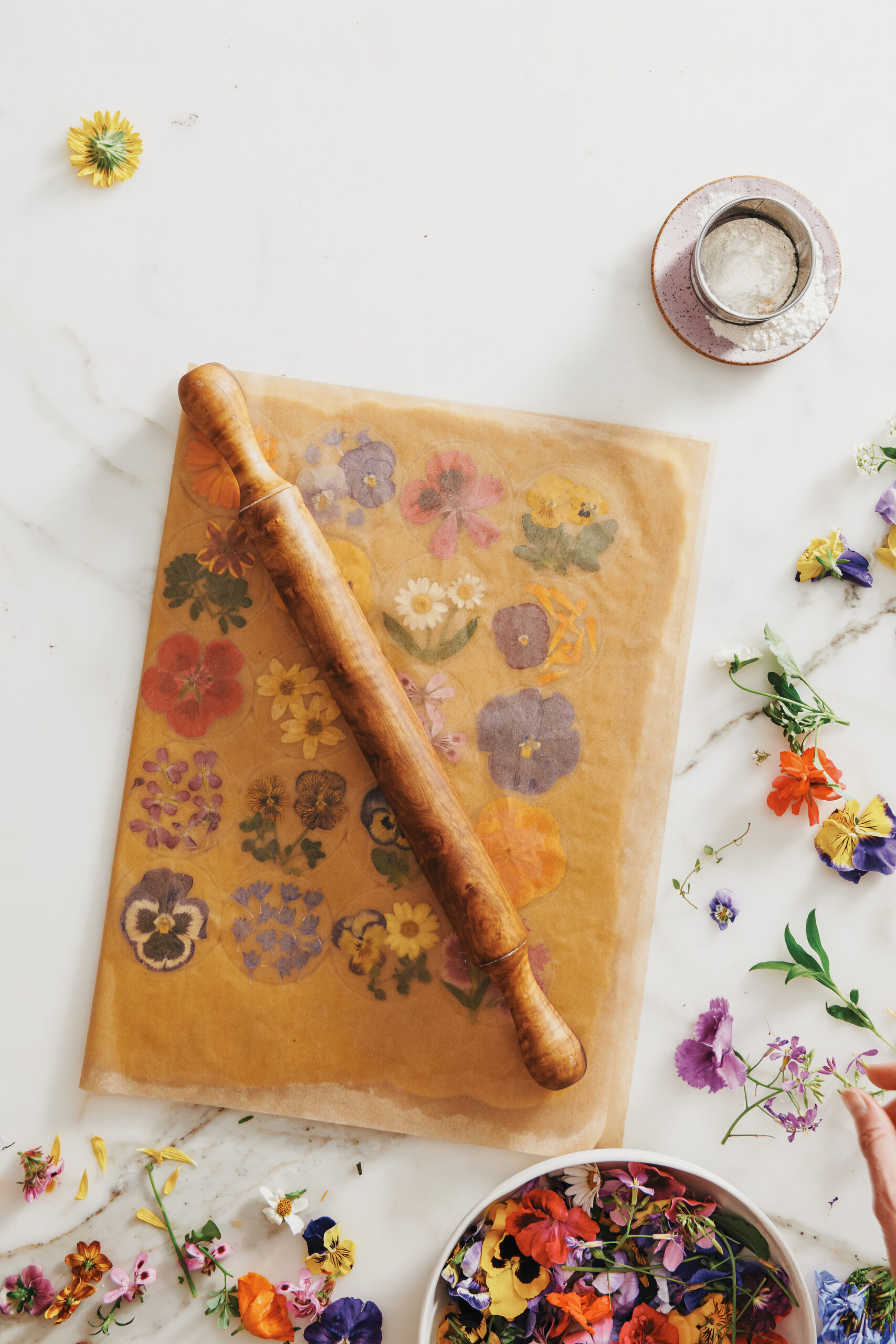 rolling flowers onto cookie dough