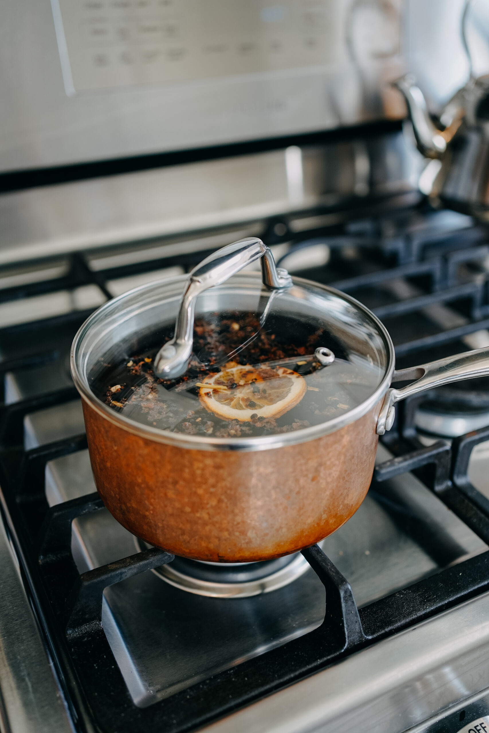 pan of herbal power punch herbs on stove with lid ready to cook