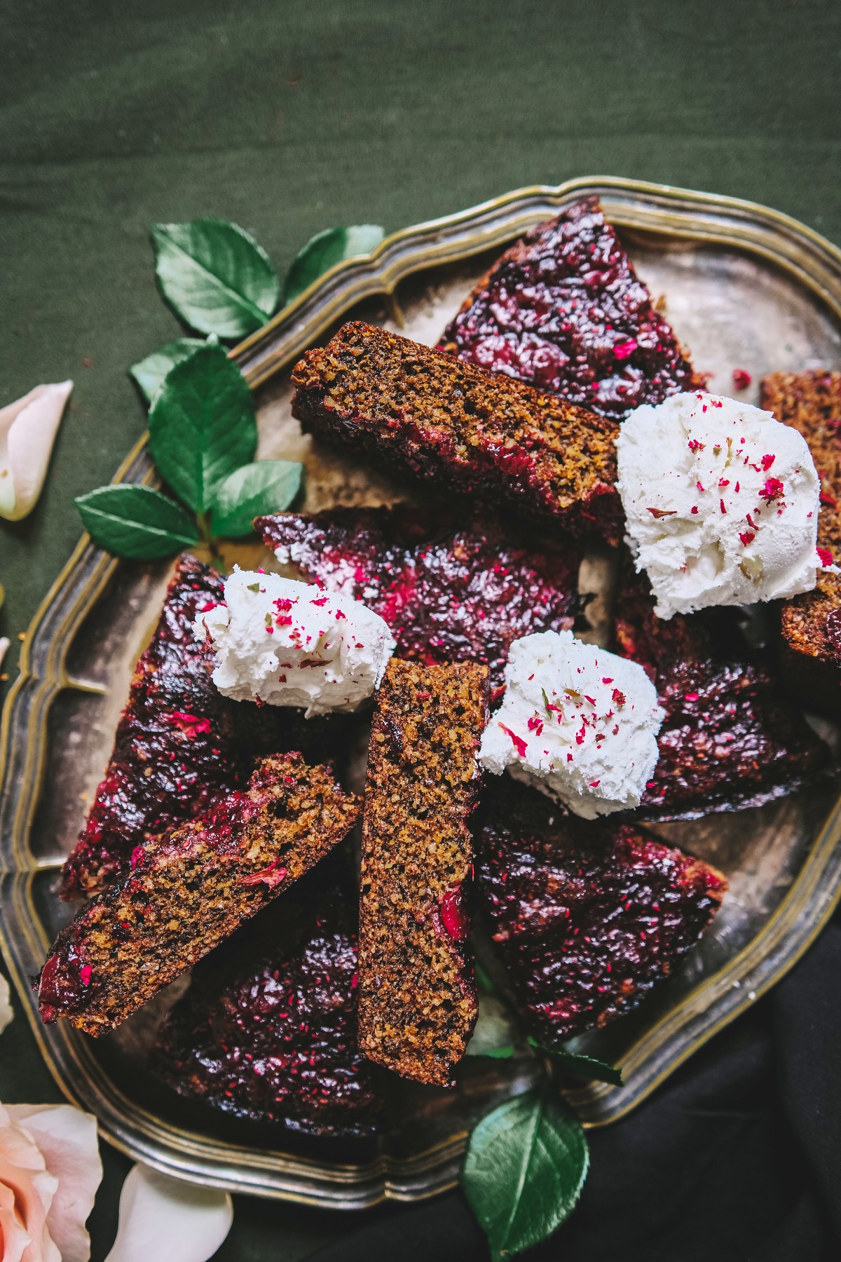 silver platter of hibiscus cake with rose ice cream on top