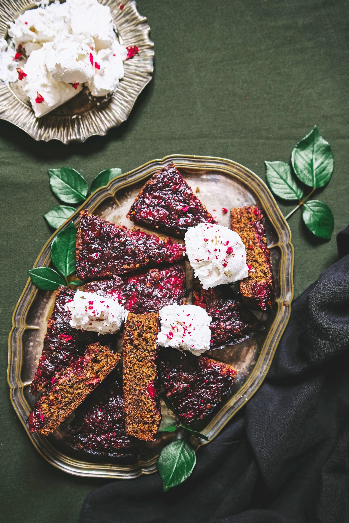 hibiscus cake on a platter with rose ice cream in a silver bowl