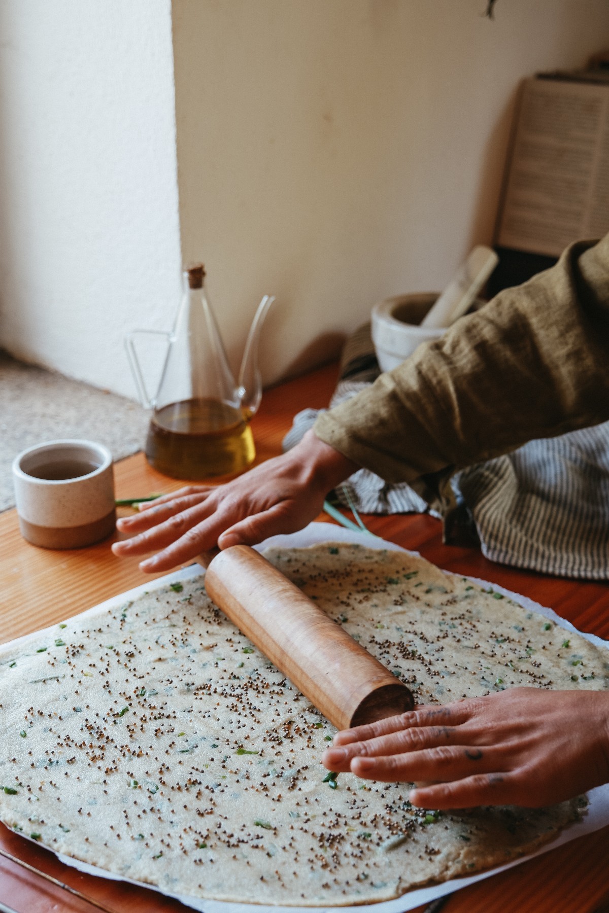 rolling out dough for homemade crackers