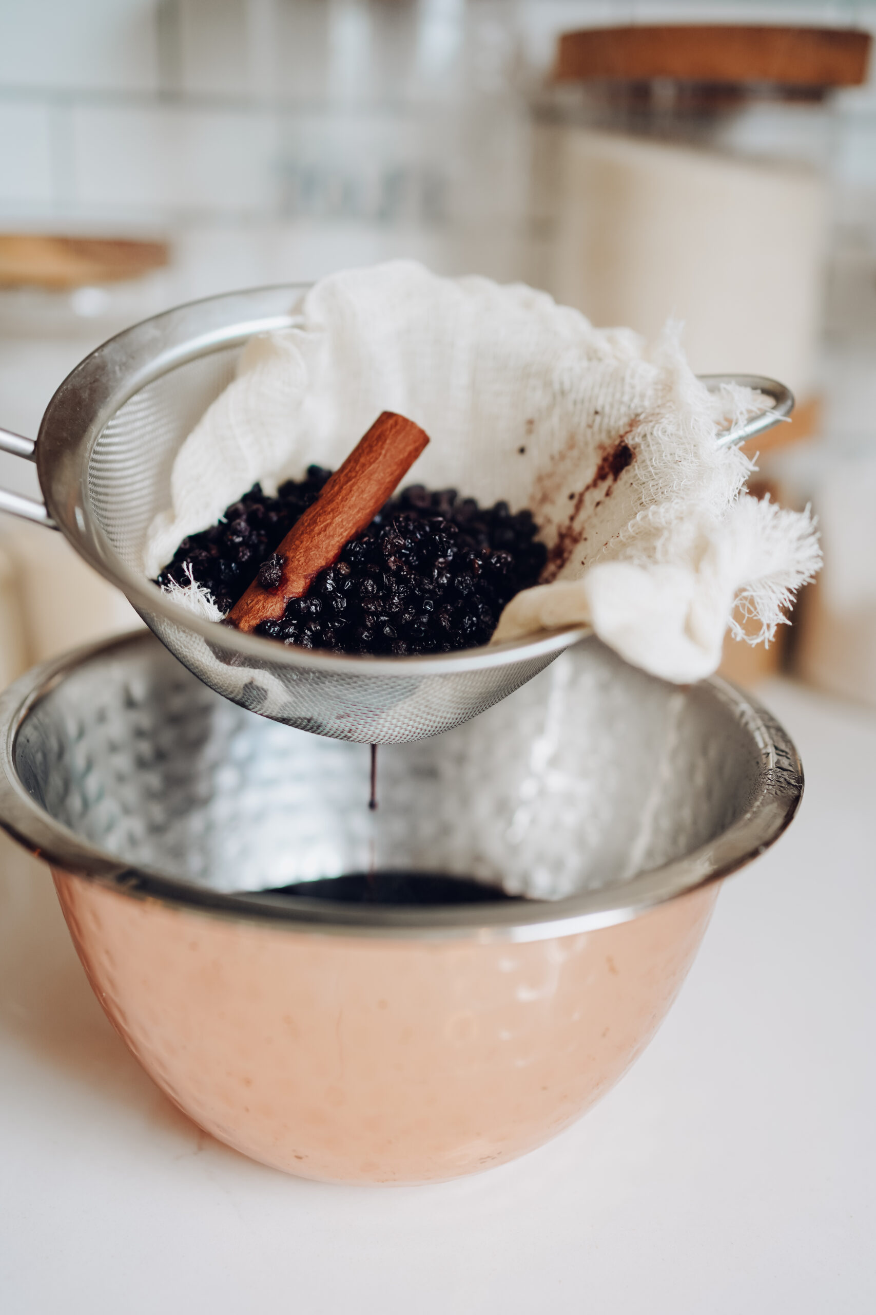 straining elderberry syrup