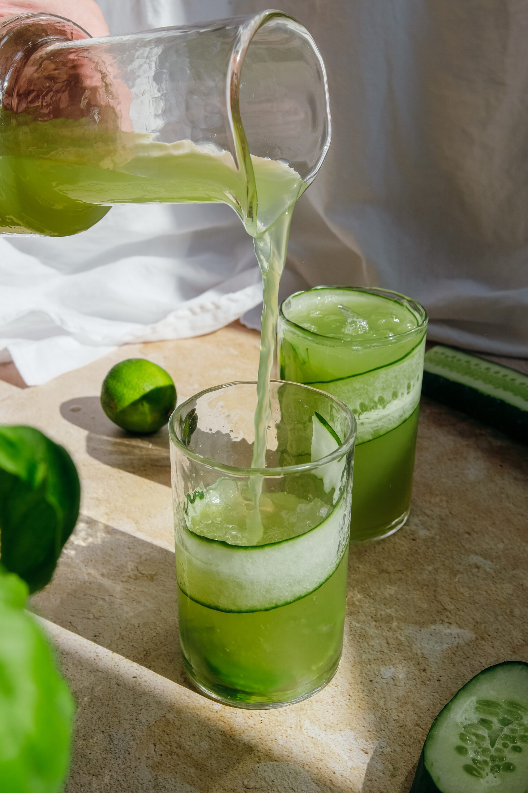 pouring limeade into glasses