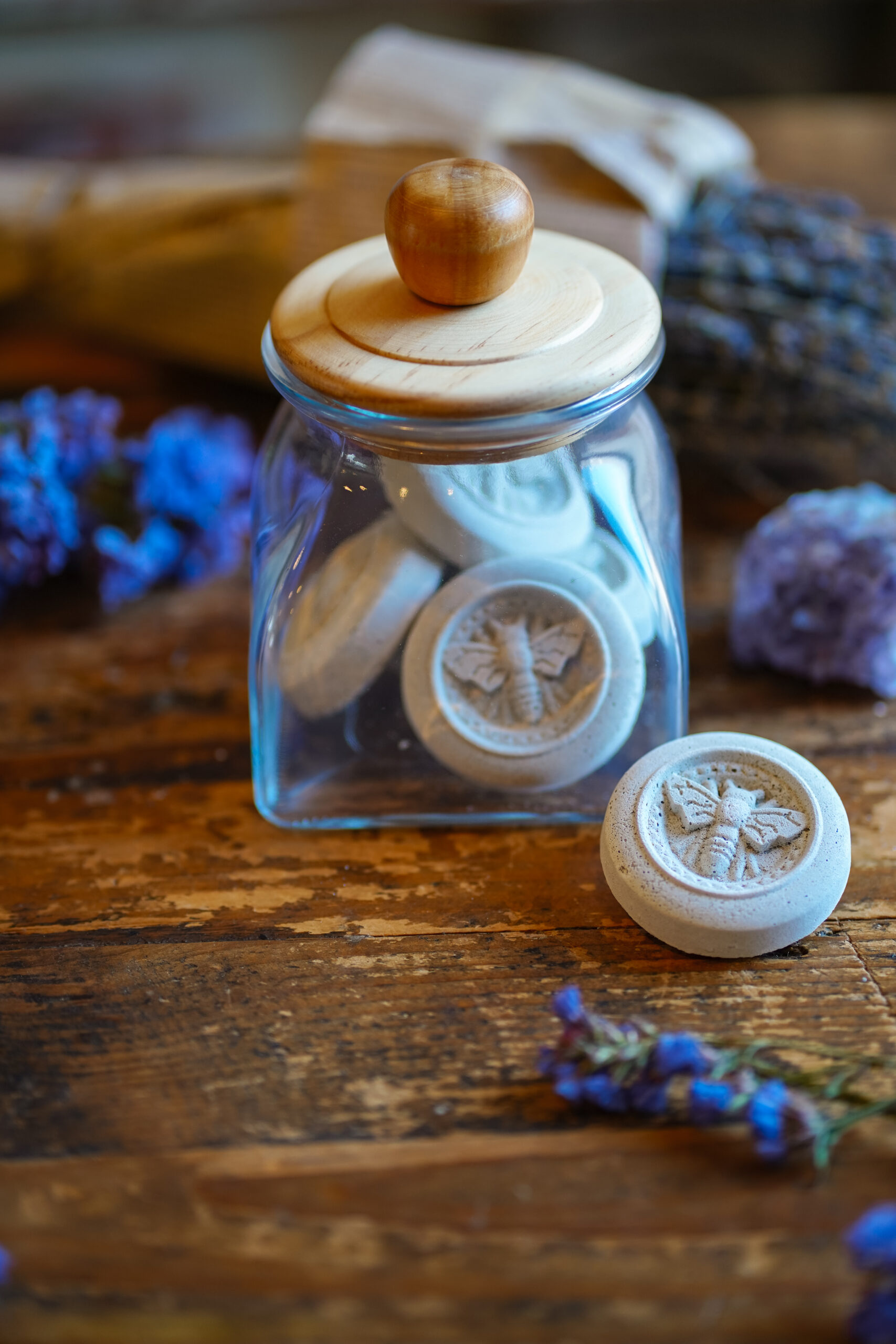 lavender shower steamers in a glass container