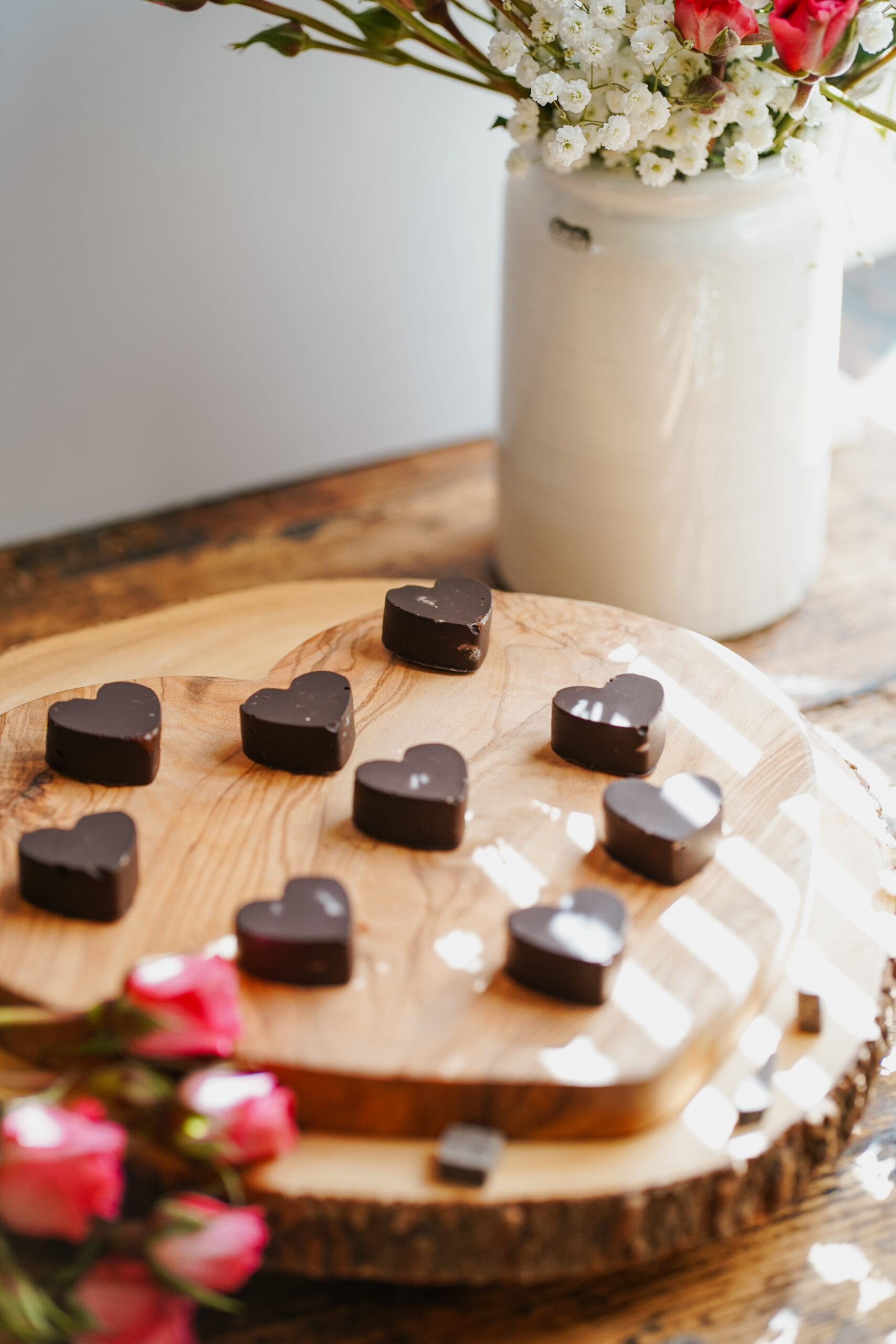 chocolate hearts on a wooden slabs