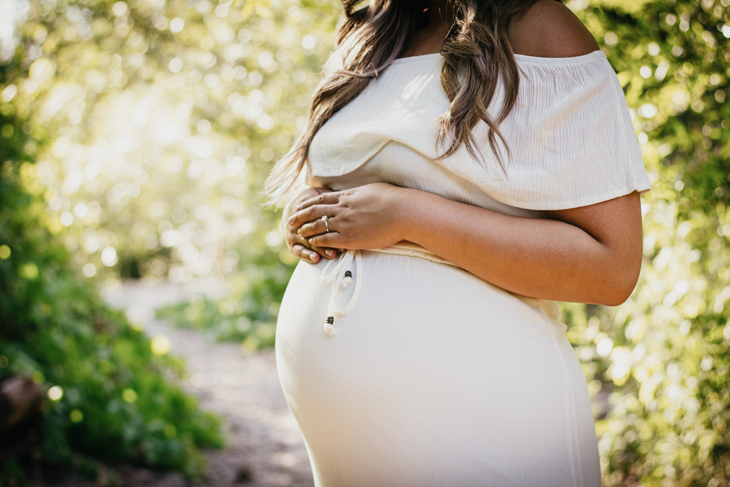 pregnant woman in a white dress