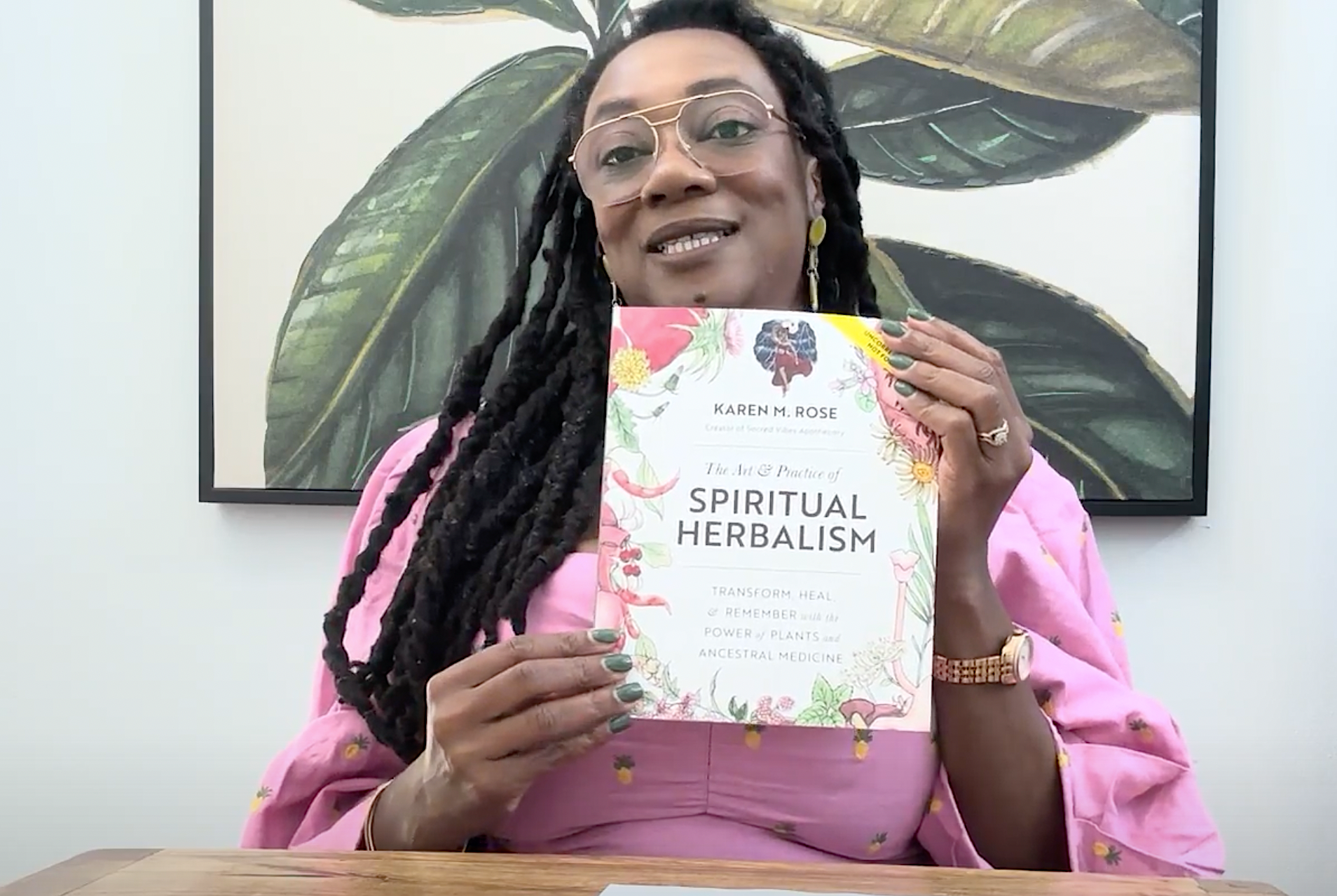 Karen Rose holding her book, The Art & Practice of Spiritual Herbalism