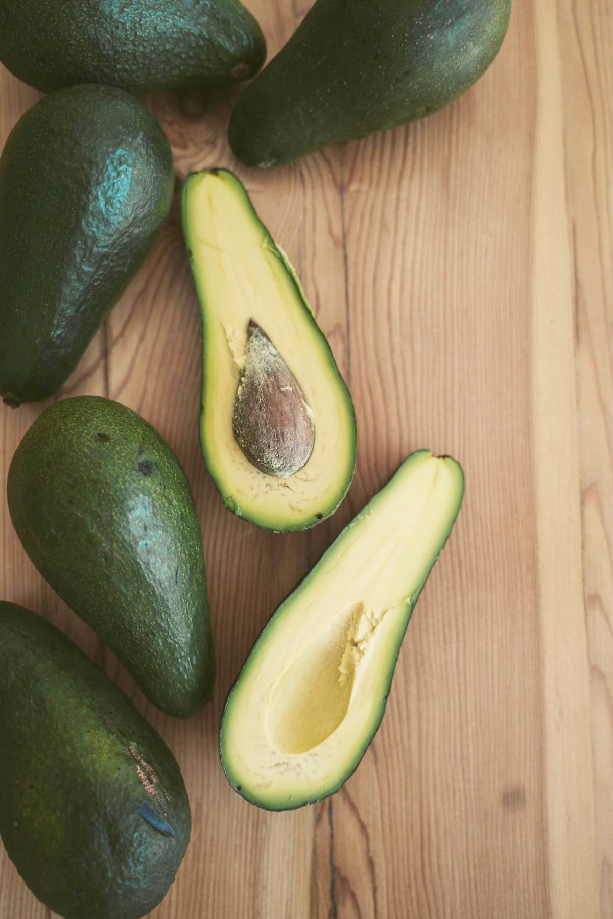 avocados on a wooden table