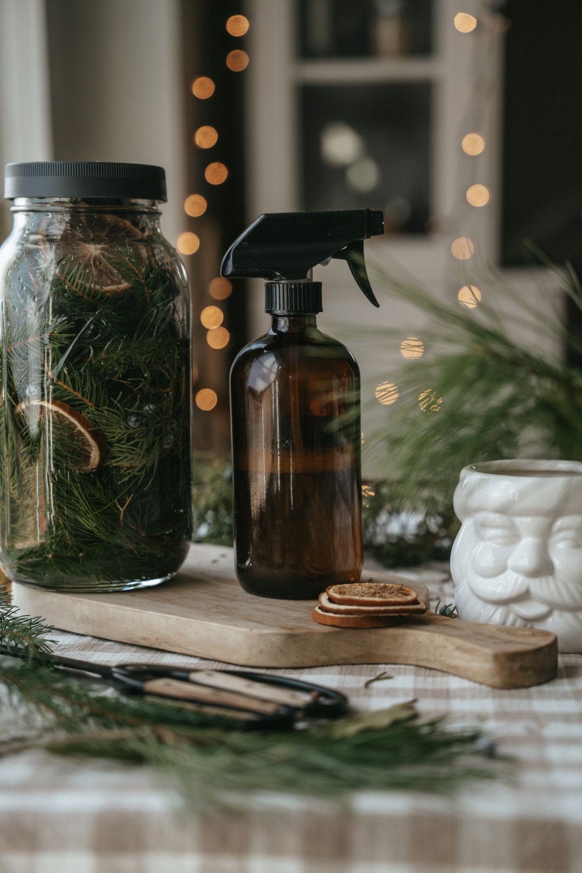 jar of evergreen cleaning spray with a spray bottle