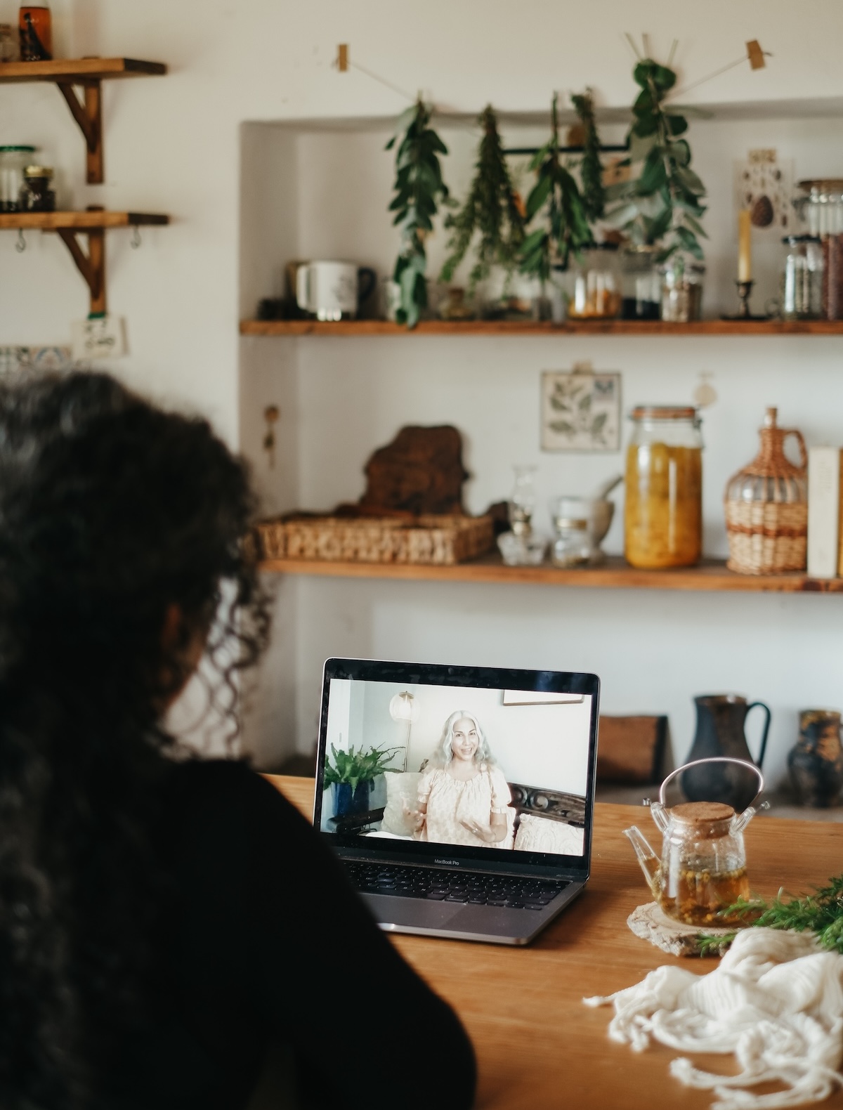 woman watching a speaker on a laptop