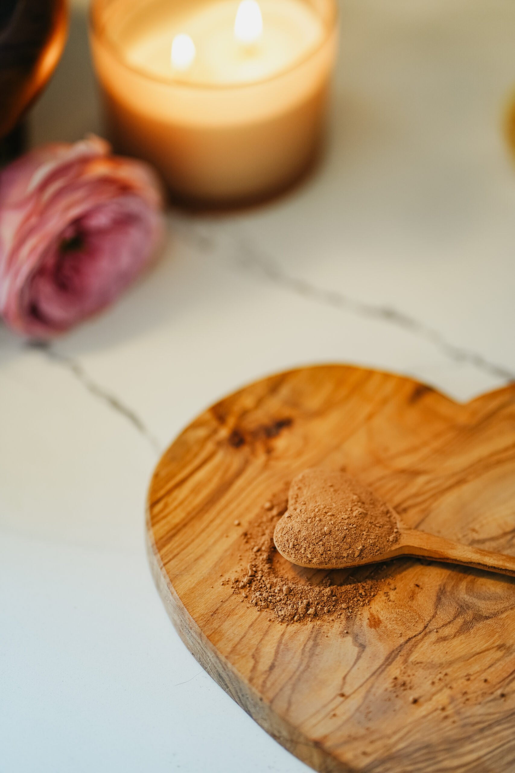 cacao on a wooden heart spoon