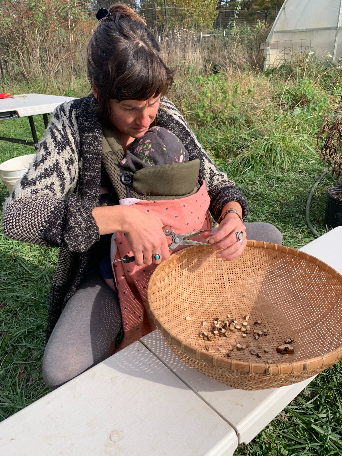 Meaghan cutting roots into a basket