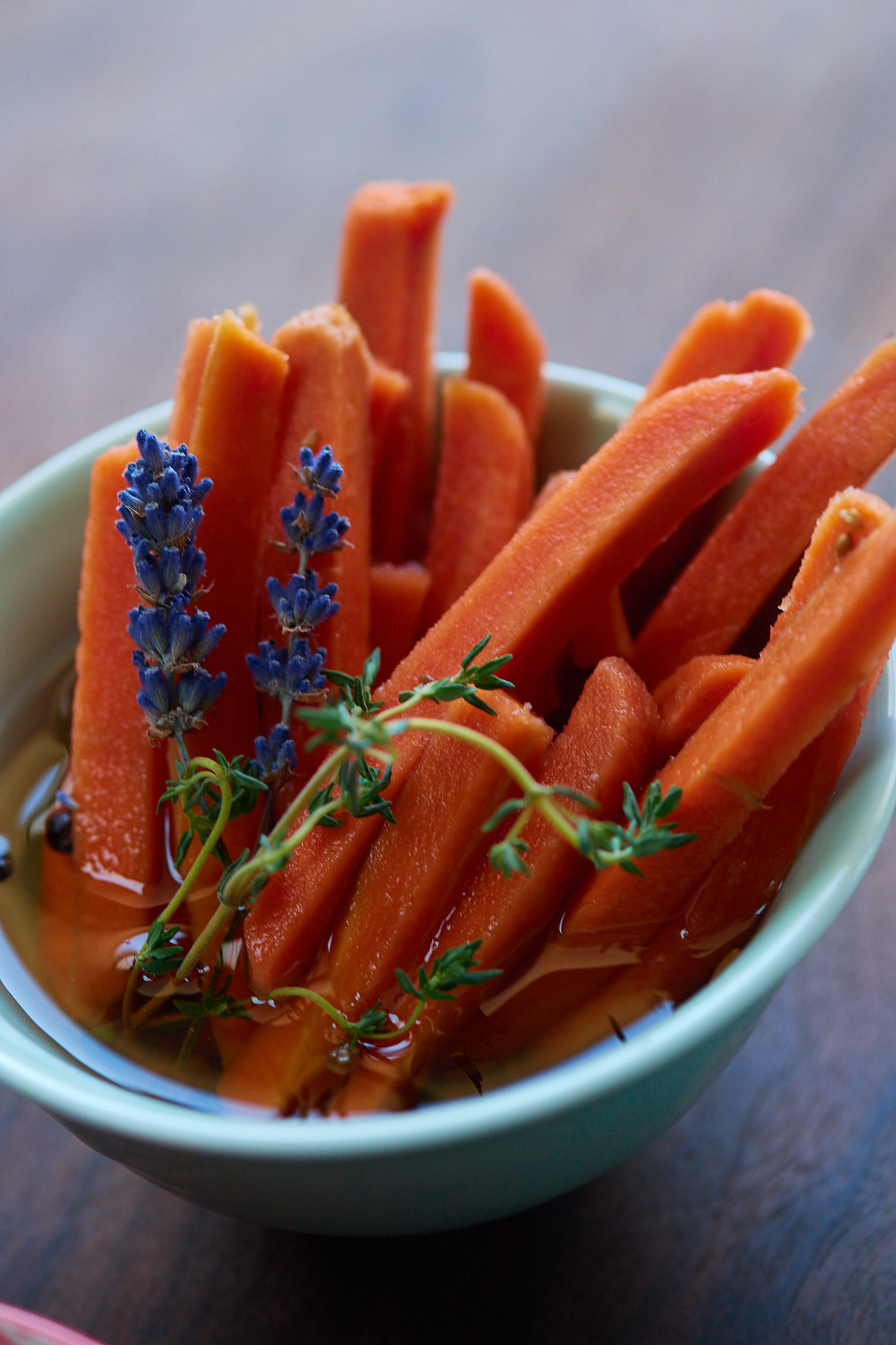 bowl of pickled carrots with lavender