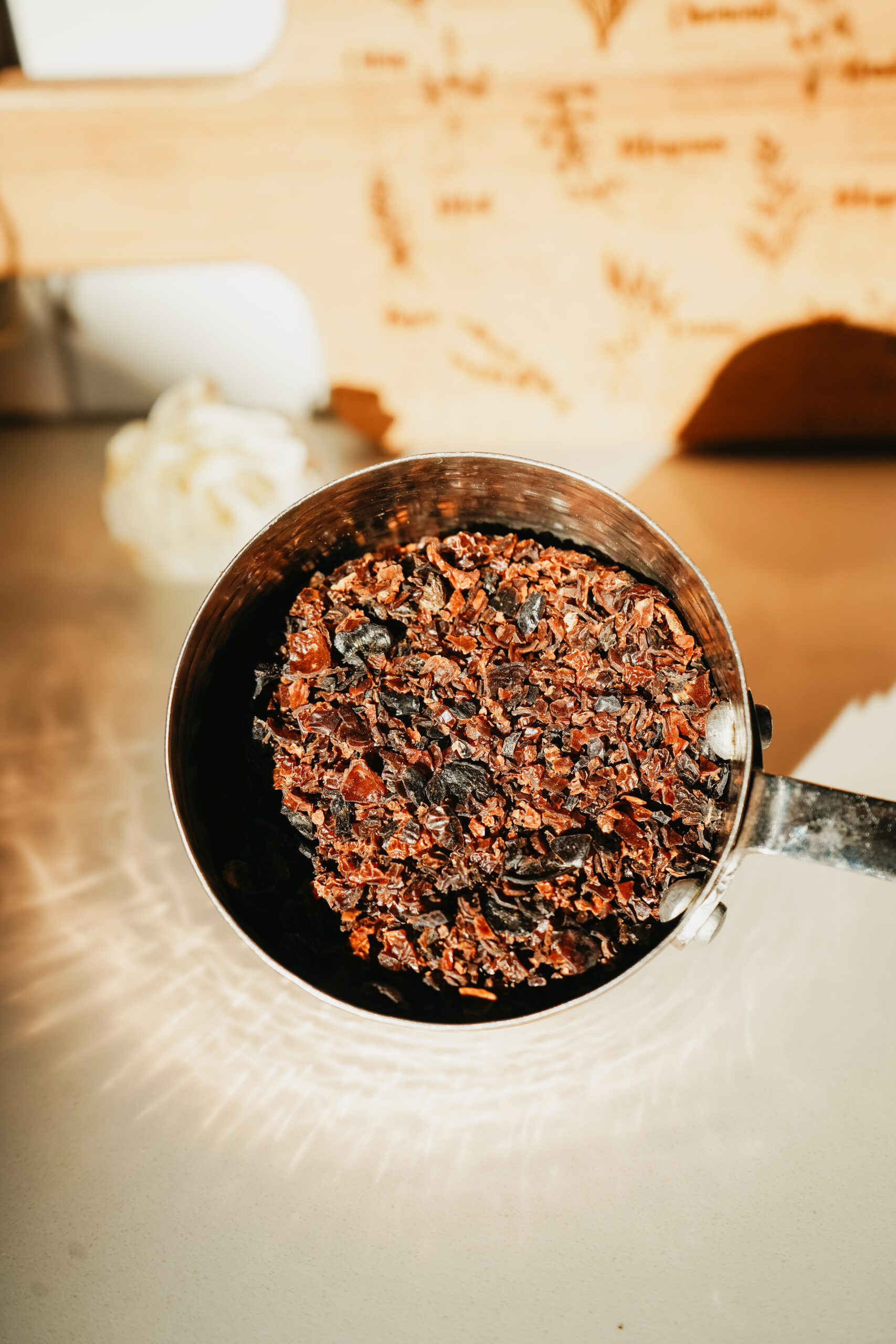 Discover this shimmering jam that perfectly captures the subtle beauty of the changing seasons: a Rosey Rose Hip Jam recipe. rose hips in a measuring cup
