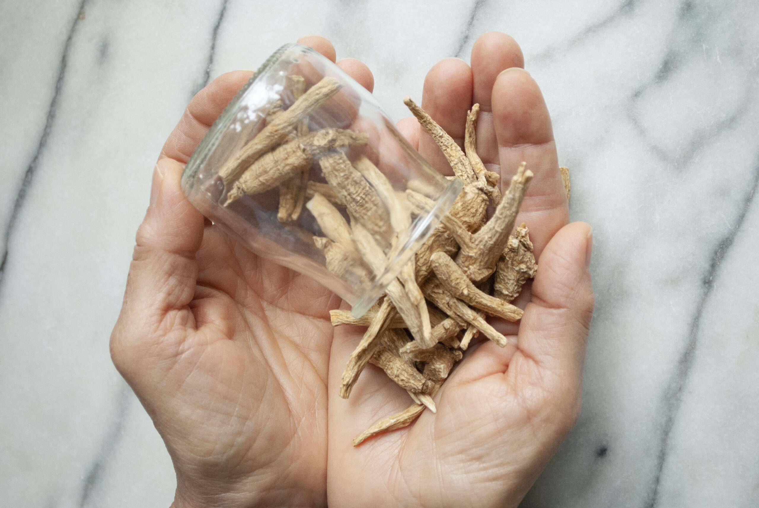 Ashwagandha root spilling out of a jar