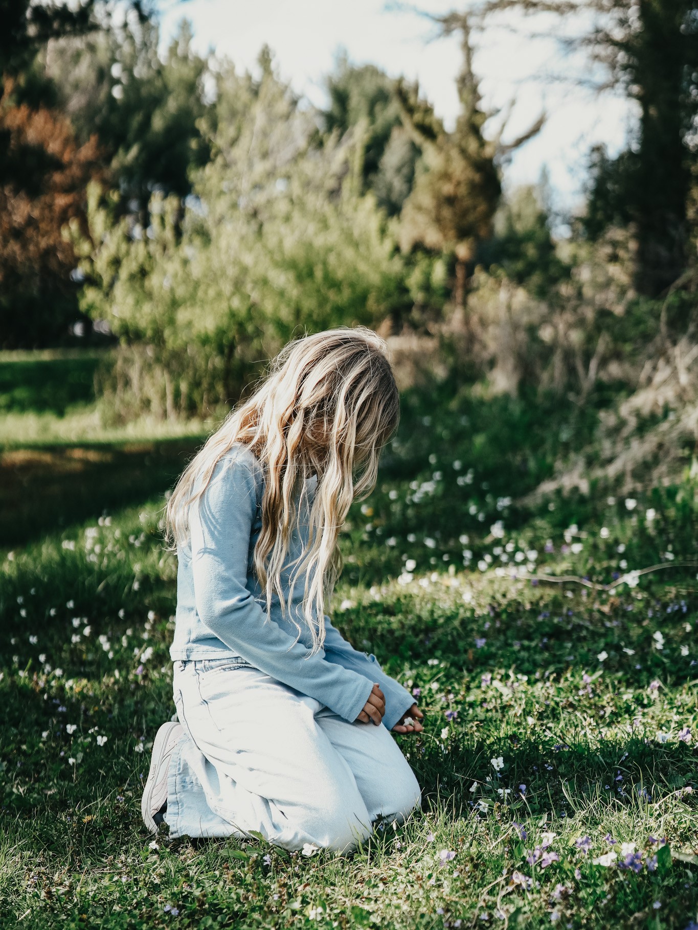 A young girl playing outside, representing tick exposure in Herbal Academy's Holistic Approach for Tick-Borne Diseases Course. 