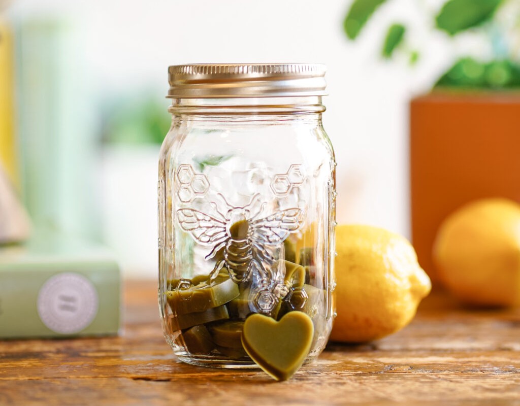 jar of gummies with lemons in the background