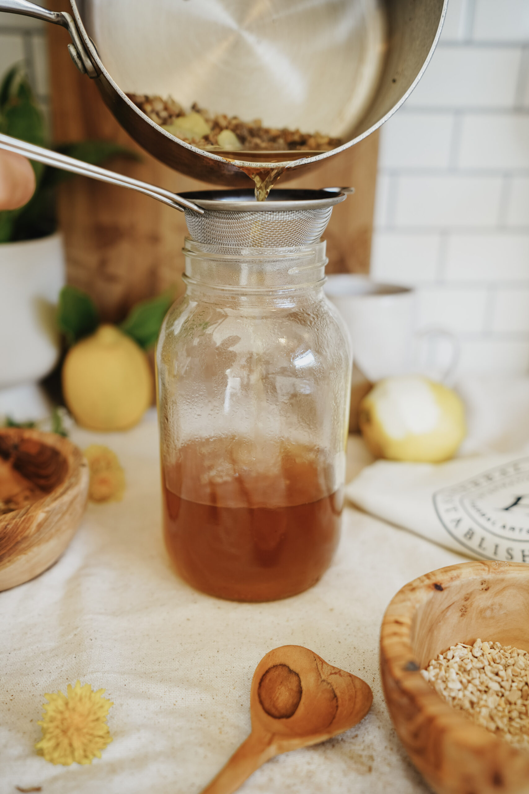 pouring a decoction into a jar