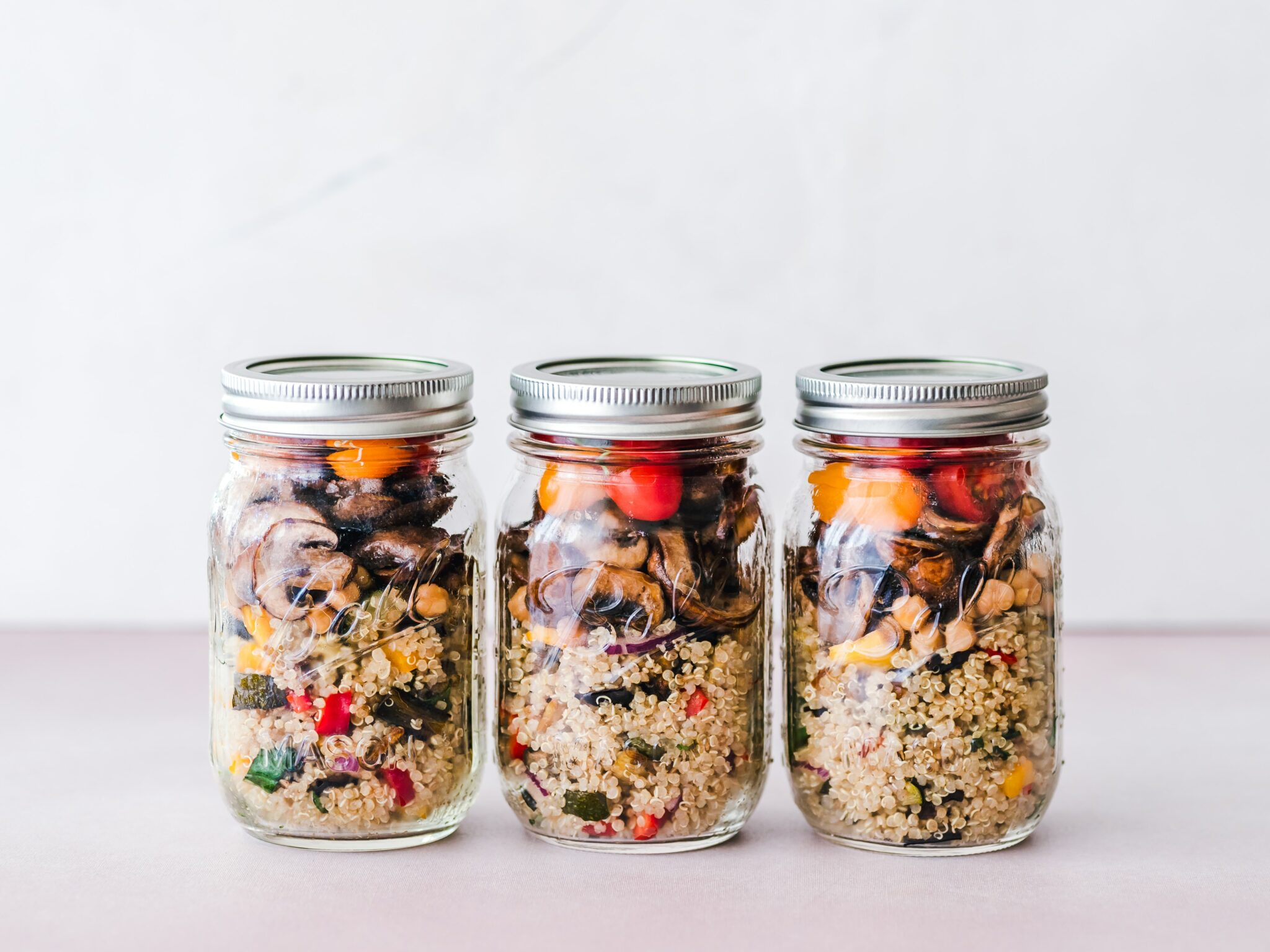 jars of quinoa and veggies